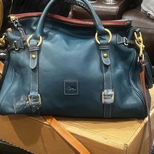 Dooney & Burke Denim blue, medium size satchel bag. red in the inside.